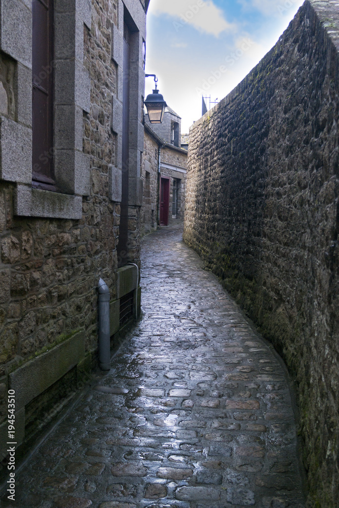 MONT SAINT-MICHEL, FRANCE - MARCH 27, 2016: Narrow stone streets of the city