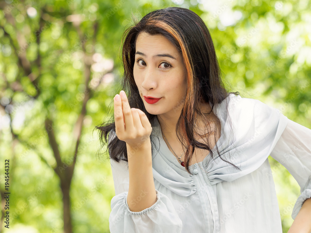 Beautiful young brunette Asian woman doing a rich gesture or counting money concept. Outdoor fashion portrait of glamour young Chinese stylish lady. Emotions, people, beauty and lifestyle concept. Beautiful young brunette Asian woman doing a rich gesture or counting money concept. Outdoor fashion portrait of glamour young Chinese stylish lady. Emotions, people, beauty and lifestyle concept.