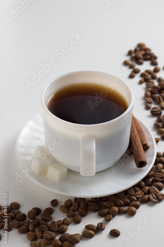 White Cup with Coffee  Coffee Beans on a White Background