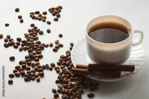 White Cup with Coffee, Coffee Beans on a White Background