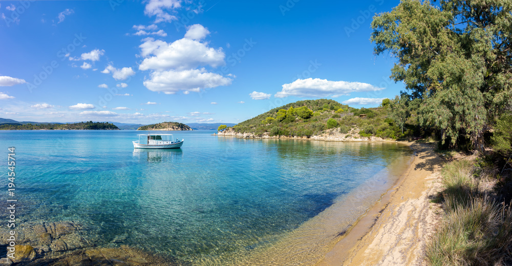 A fishng boat on the gorgeous sea waters of Sithonia, Chalkidiki, Greece A fishng boat on the gorgeous sea waters of Sithonia, Chalkidiki, Greece