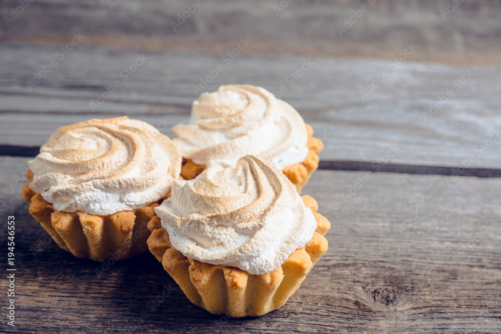 Creamy cake on the rustic background. Selective focus. Creamy cake on the rustic background. Selective focus.