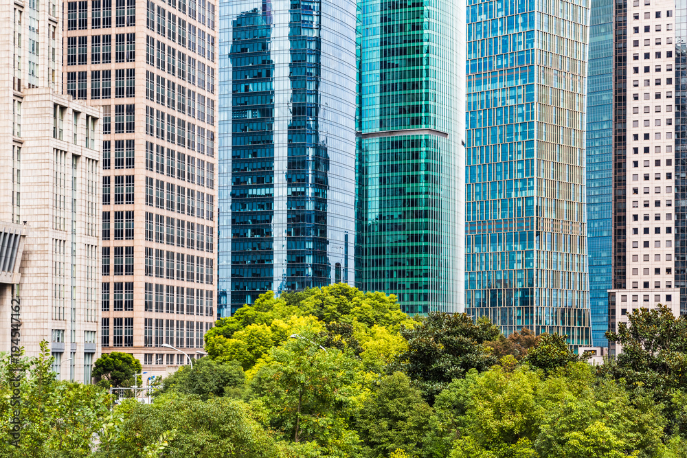 China,shanghai,modern office towers with green trees