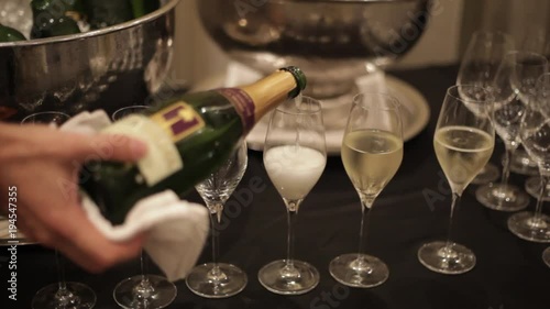 Bartender serving sparkling wine, champagne
