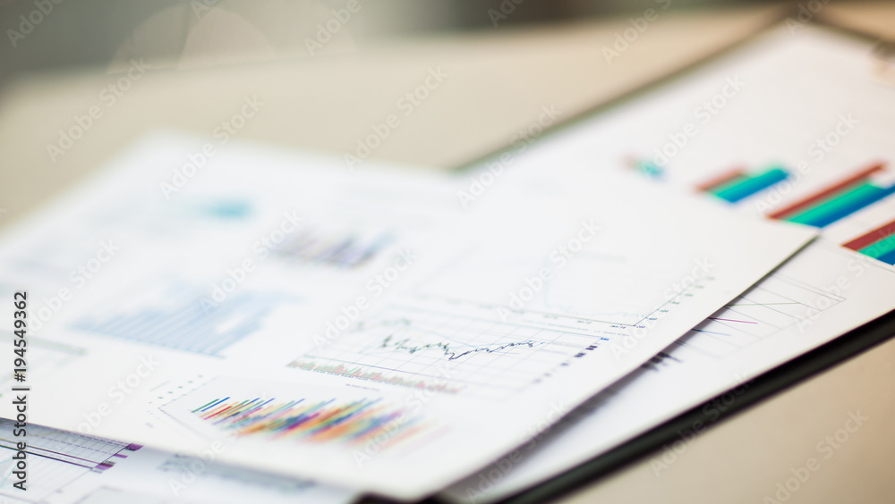 financial charts and graphs on the table financial charts and graphs on the table