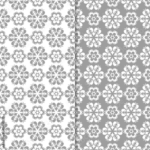 White and gray floral backgrounds. Set of seamless patterns