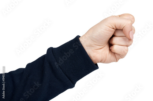 Female hand shows fist gesture and sign. Isolated on white background. Dark blue pullover