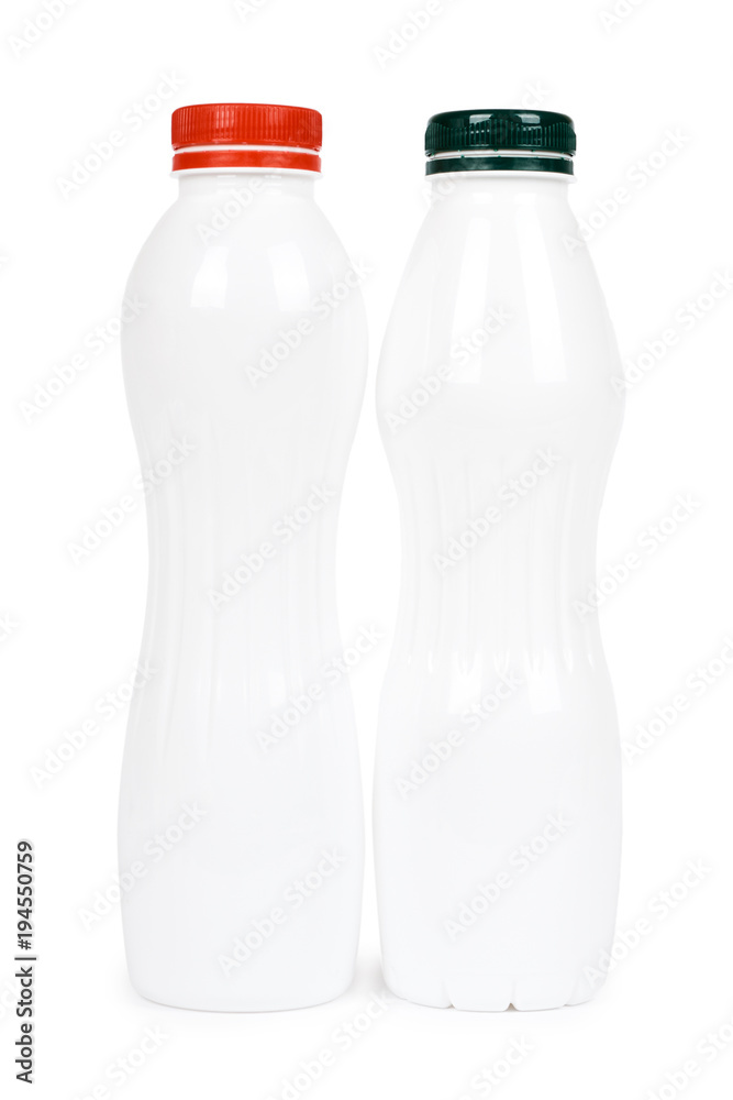Two white plastic bottles with drink yogurt or milk. Isolated on white background. Container merchandise template Two white plastic bottles with drink yogurt or milk. Isolated on white background. Container merchandise template