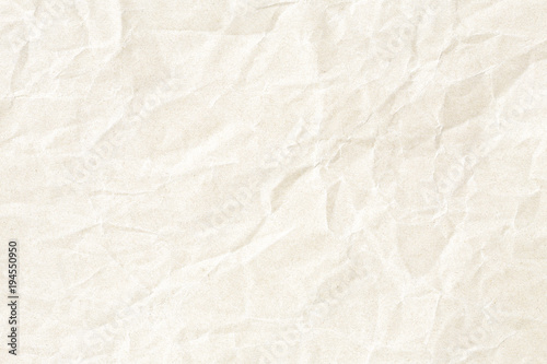 Crumpled pale yellow paper texture