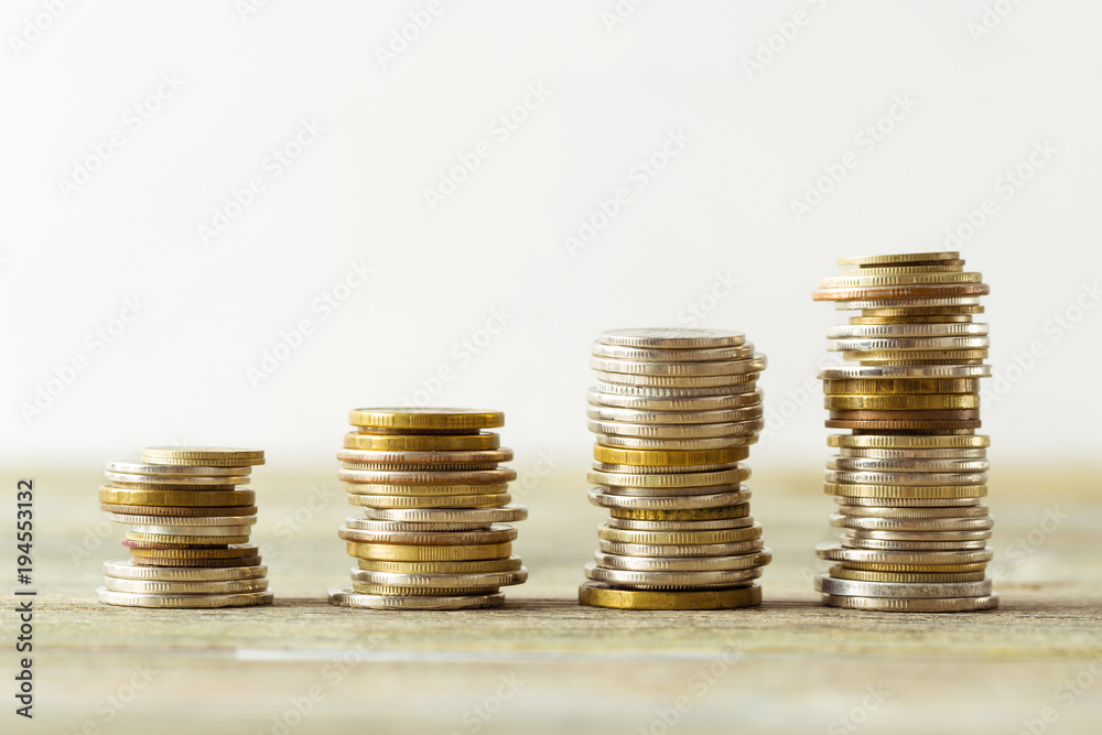 coins stack on wooden table