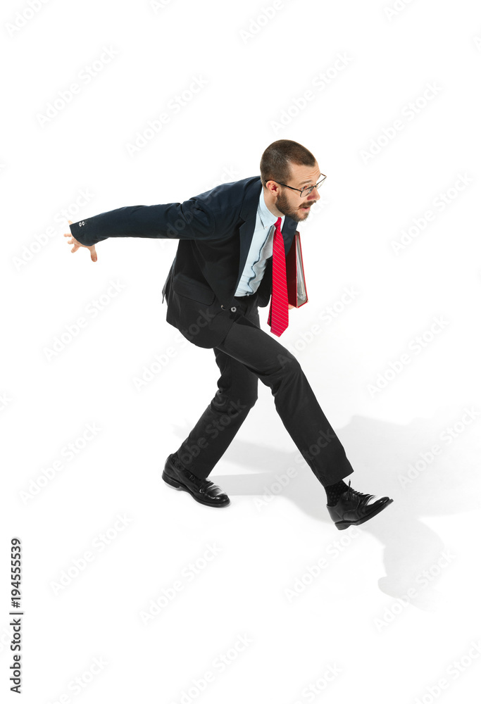 Businessman running with a folder on white background Businessman running with a folder on white background