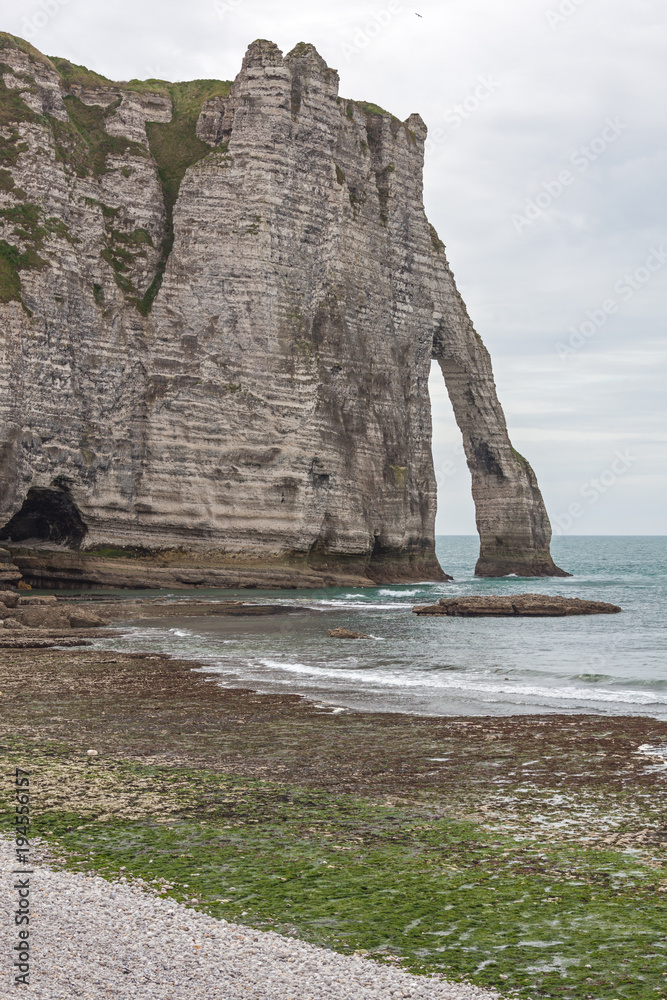 Famous chalk cliffs and natural arches located on the coast of the Pays de Caux area at Etretat, Normandy, France