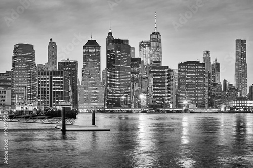 Black and white New York City skyline at night  USA.