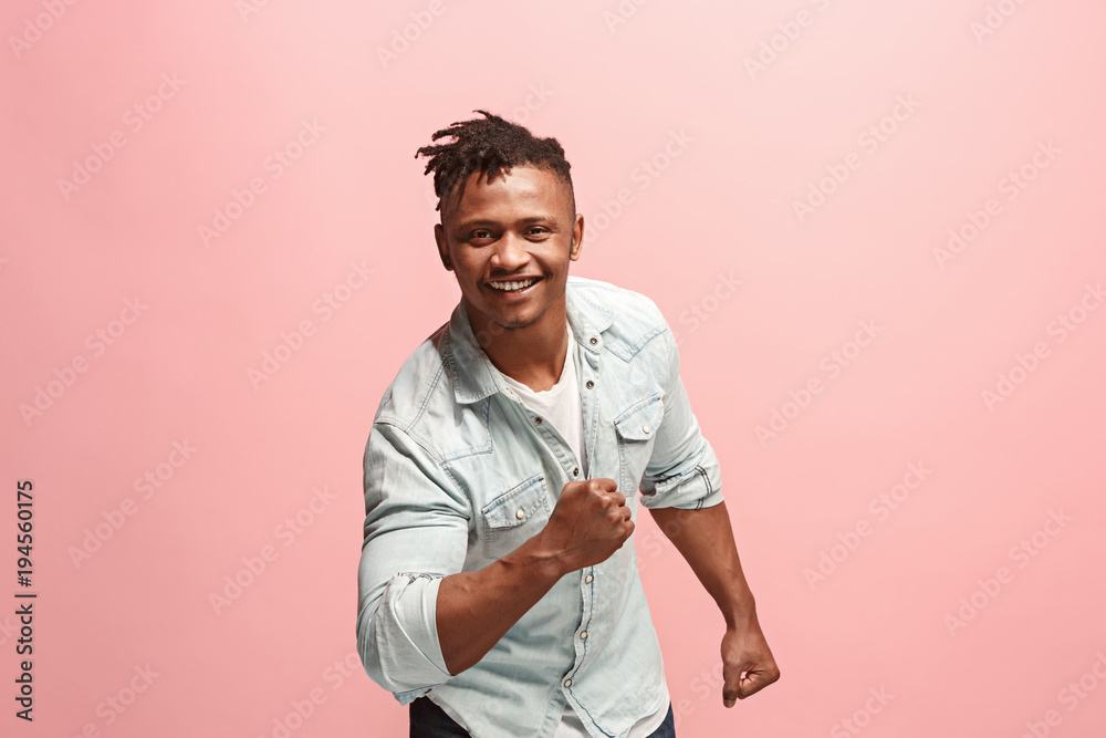 Winning success man happy ecstatic celebrating being a winner. Dynamic energetic image of male model Winning success man happy ecstatic celebrating being a winner. Dynamic energetic image of male model