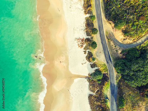 Stunning wide angle aerial drone view of Otama Beach and Black Jack Road near Matarangi on the Coromandel Peninsula in New Zealand. Beautiful pattern / texture of ocean, beach, trees and the road.  © Juergen Wallstabe