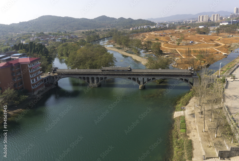 Green river under ancient Chinese bridge