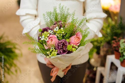 Female hands holding a little beautiful valentine bouquet