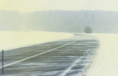 Winter. Blizzard snowstorm winter road of a snowy landscape. On the road there are no car