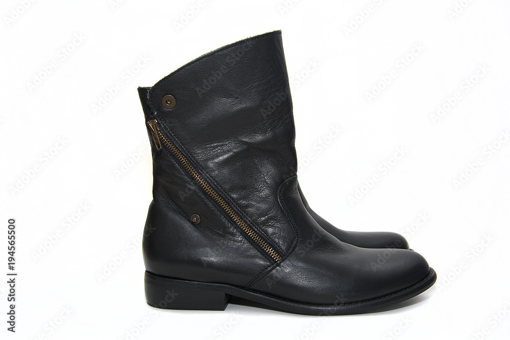 Black female leather boots isolated on white background.