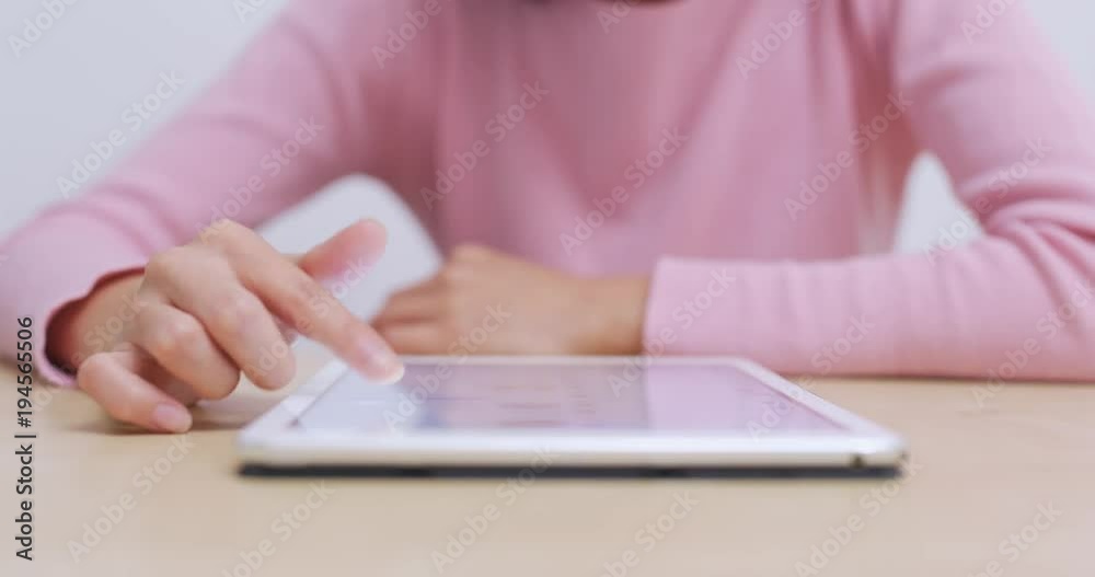 Woman use of tablet computer at home Woman use of tablet computer at home