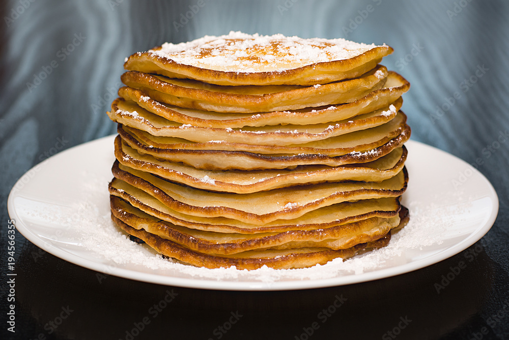 Pancakes in powdered sugar.