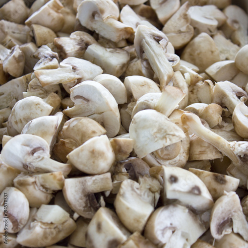Peeled raw mushrooms champignons close-up. Selective focus