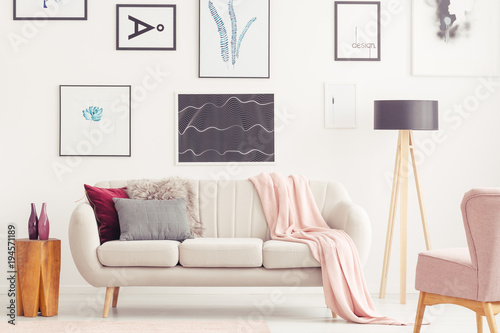 Pink living room with posters