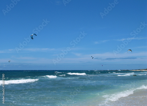 Saint Paul / La Reunion: Kite surfers at the beach of Boucan Canot in the west of the tropical island