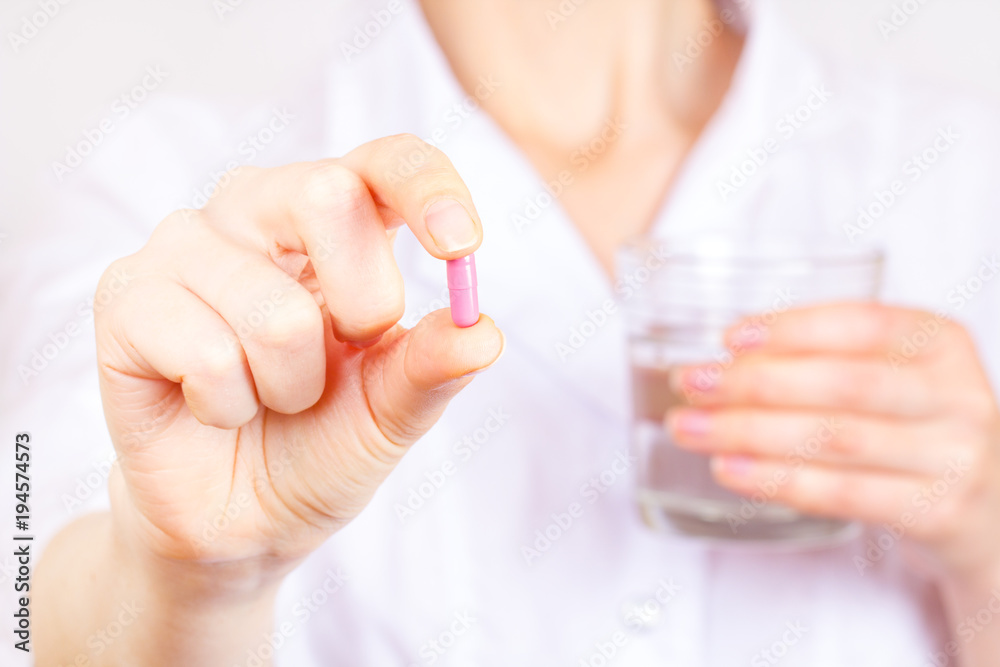Tablet capsule hand doctor pharmacist white girl gown vitamin treatment.
Tablet capsule hand doctor pharmacist white girl gown vitamin treatment.