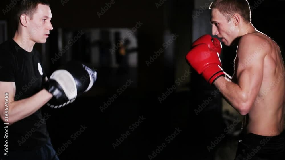 Man Trains Boxing with Trainer Man Trains Boxing with Trainer
