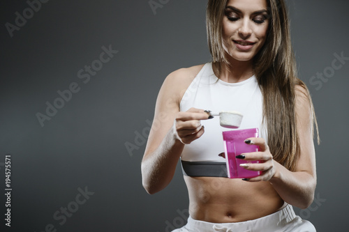 girl with supplement whey protein shake powder