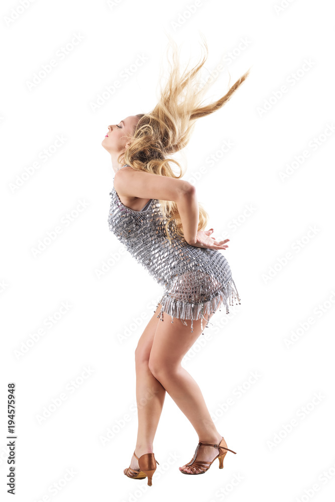 Side view of bend bowing female dancer with flowing hair toss in shiny dress. Full body length portrait isolated on white studio background. 