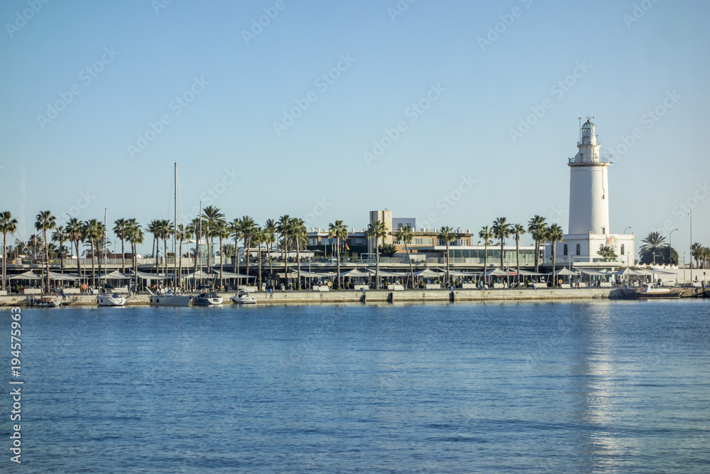  Port view and tower lighthouse, Malaga, Spain.