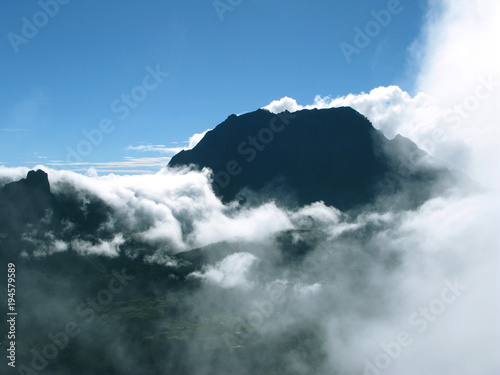 Saint Paul / La Reunion: View from the Maido peak over the Cirque de Mafate to the Piton des Neiges in the early morning when orographic clouds begin to cover the landscape photo