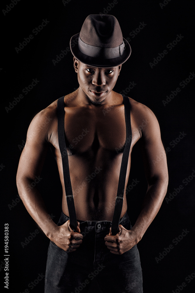 afro-american man in hat and suspenders