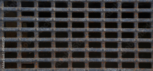 Metal rusty iron grate of storm sewage  background