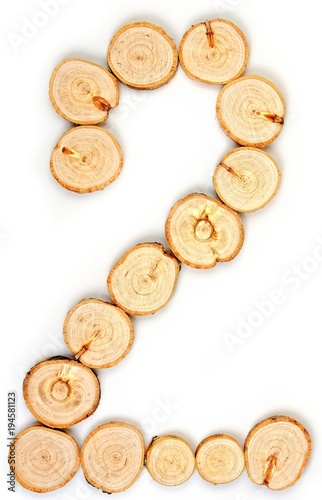 Number made of wood slice on a white background. 2