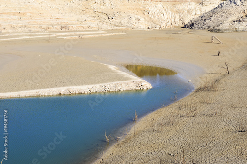 Empty lake at Bimont Dam near Aix en Provence, France. photo