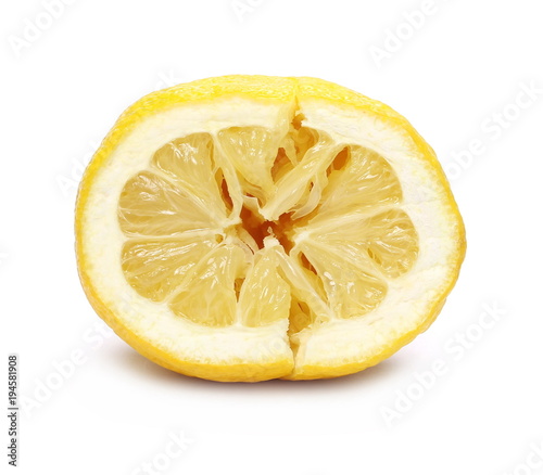 squeezed lemon isolated on white