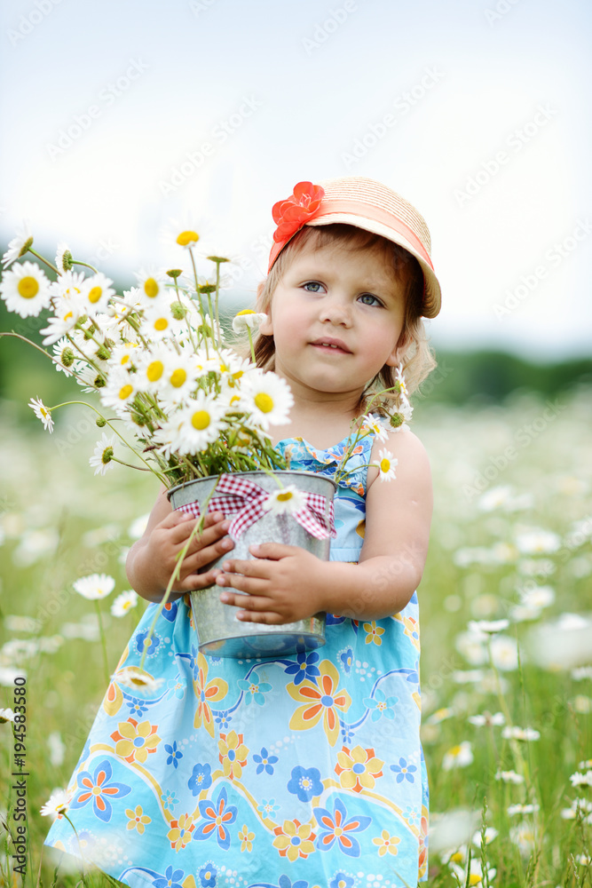 toddler girl in field