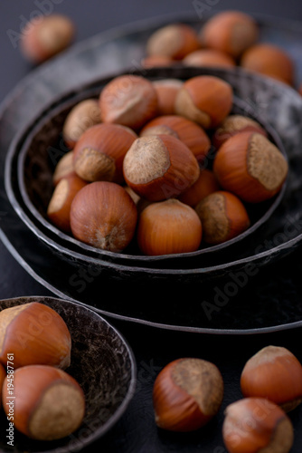 Close-up hazelnuts in metal plate