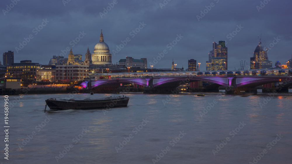 London's night skyline, looking at Blackfriars bridge and St. Pauls Cathedral, London, UK. 