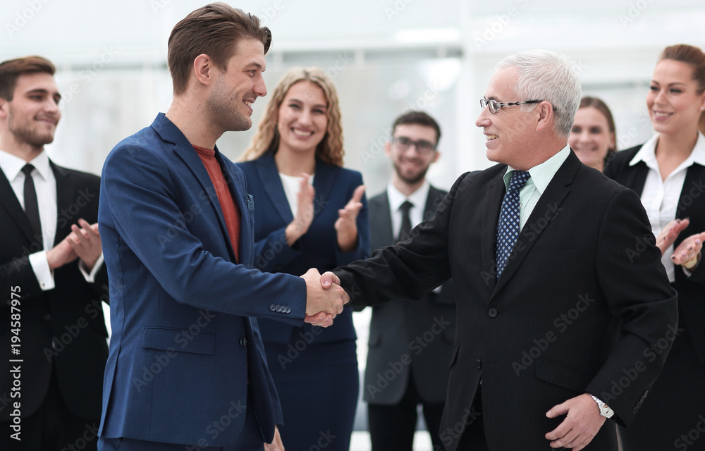 handshake of business partners after a business meeting in the office handshake of business partners after a business meeting in the office