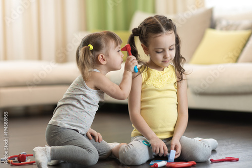 Children playing doctor and...