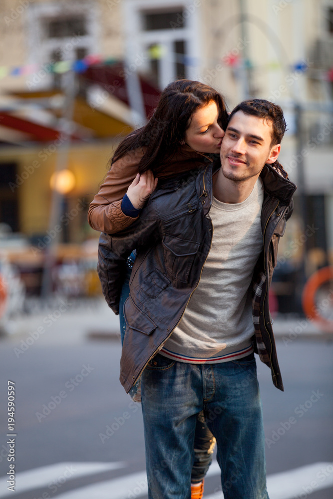 Young couple hugging on the streen on the first date