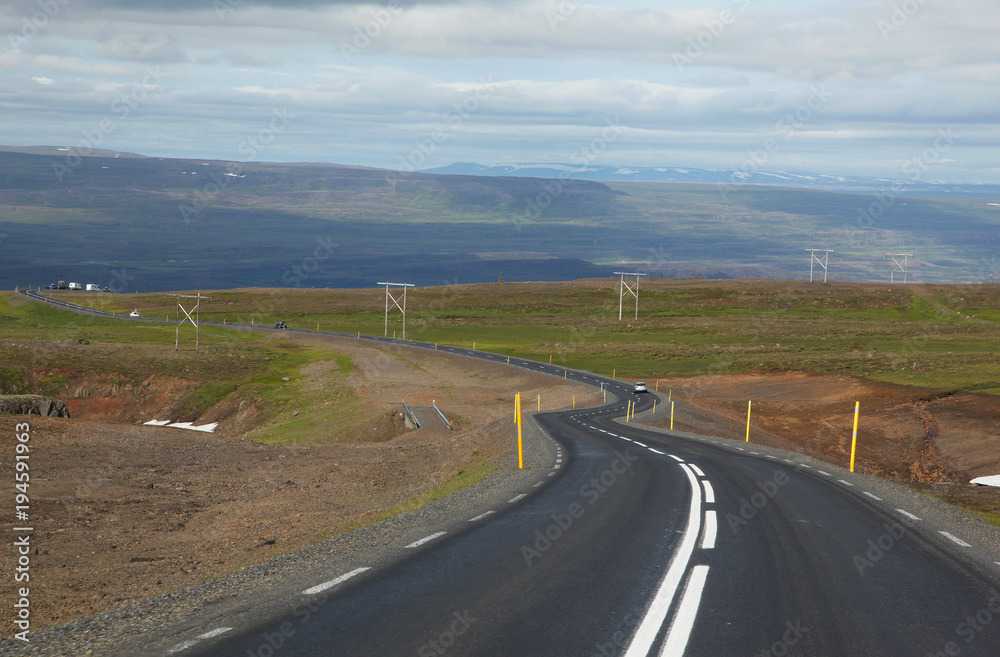 Fototapeta premium Icelandic road with clouds