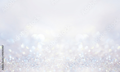 Obraz na płótnie Glitter background in pastel delicate silver and white tones de-focused