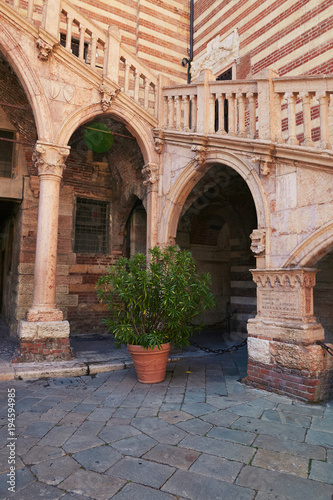 VERONA  ITALY - AUGUST 17  2017  Piazza Dante in Verona. palaces around the square and a statue of Dante Alighieri.