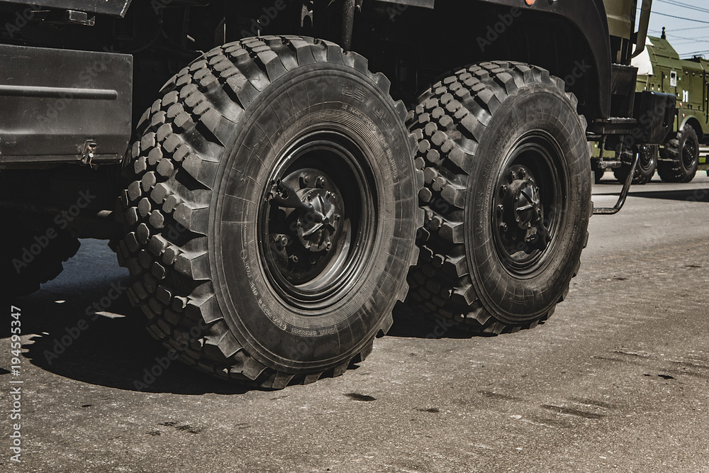 The wheel of a fighting vehicle standing in the park