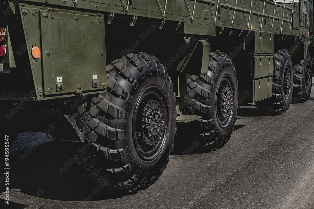 The wheel of a fighting vehicle standing in the park